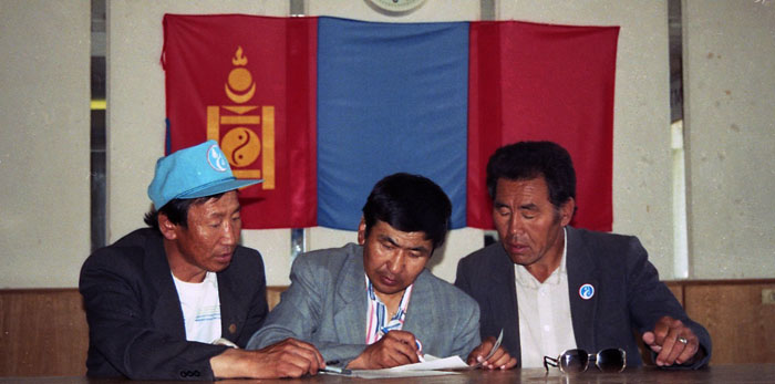 Mongolian election comission studying a ballot